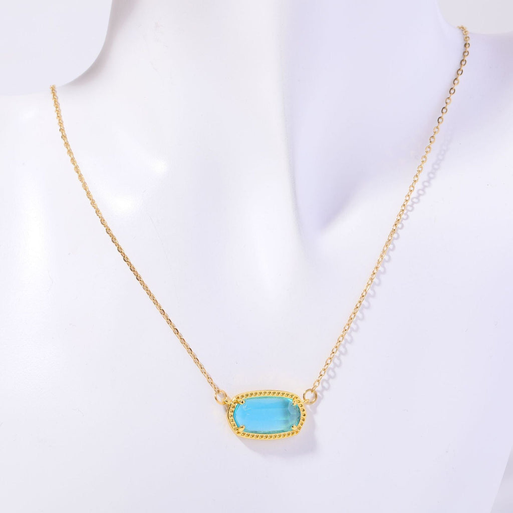 Necklace with a turquoise pendant on a mannequin against a white background
