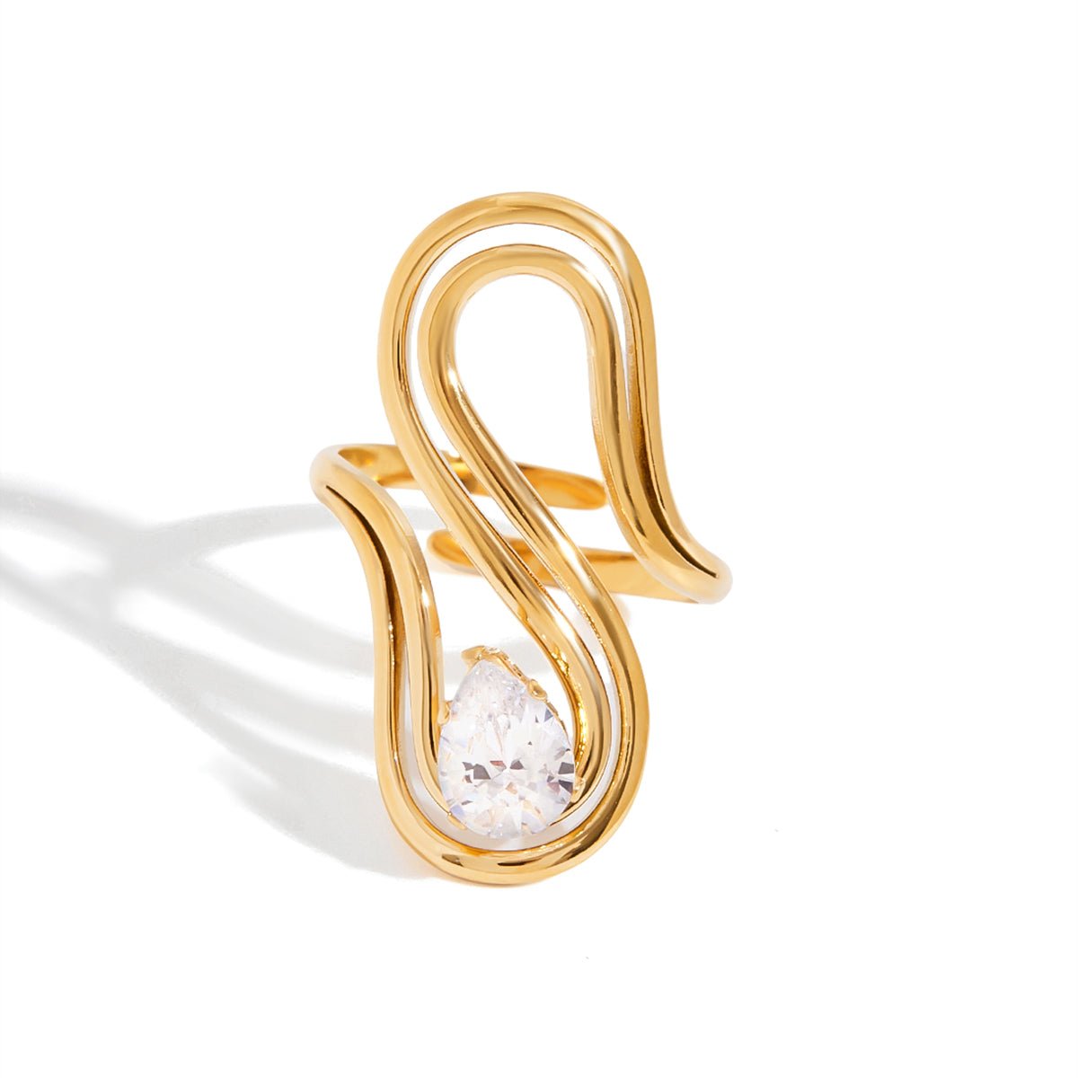 Gold ring with a diamond on a white background