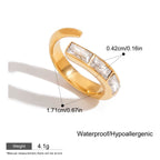 Gold ring with gemstones on a white background, showing measurements and product details.