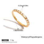 Gold ring with clear stones, showing measurements and product details on a white background.