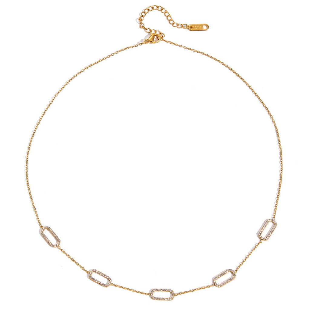 Gold chain necklace on a white background