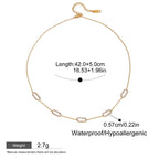 Gold necklace with measurement details on a white background