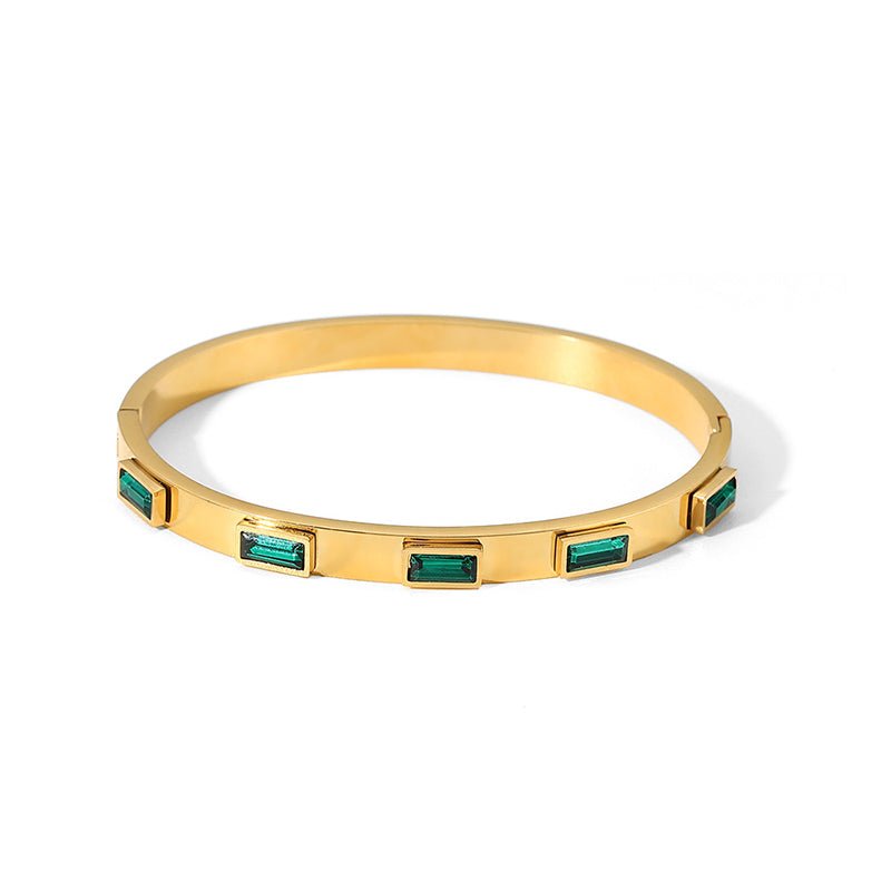 Minimalist bangle bracelet with green baguettes