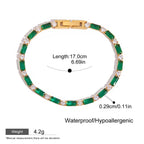 Gold tennis bracelet with baguette emeralds and round white gems

