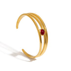 Elegant women’s bracelet with red garnet and open band