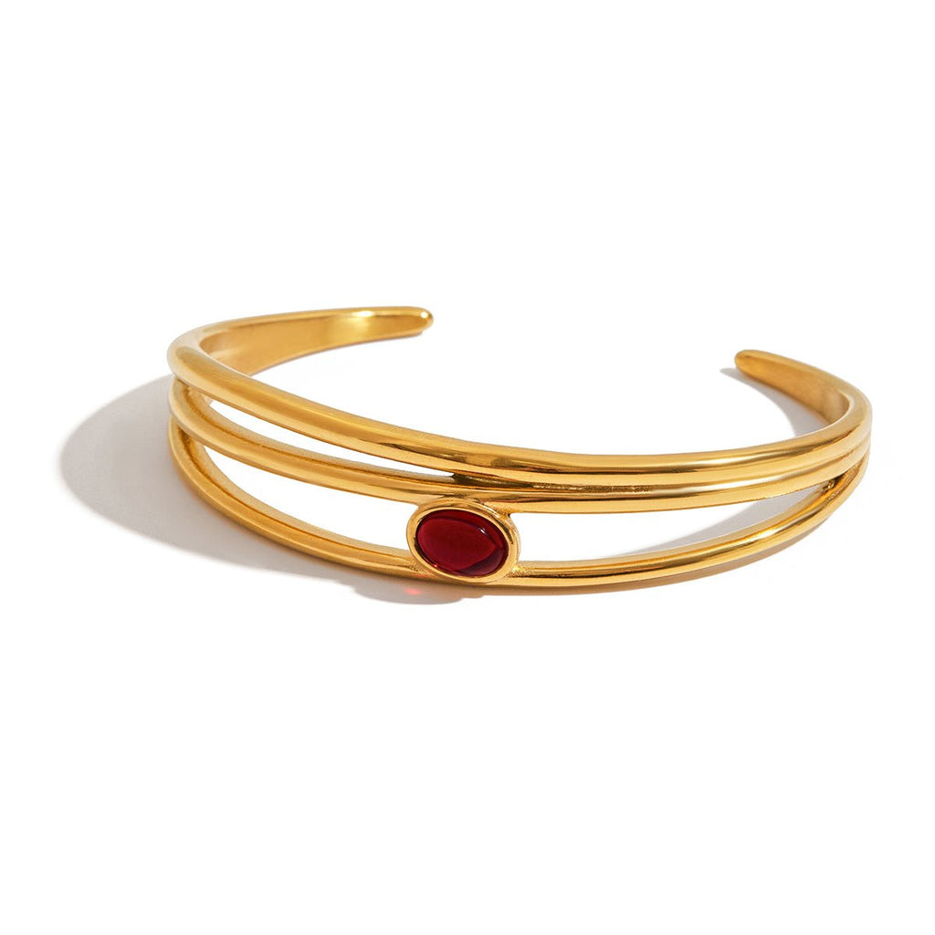 Gold and red gemstone bracelet styled for gifting