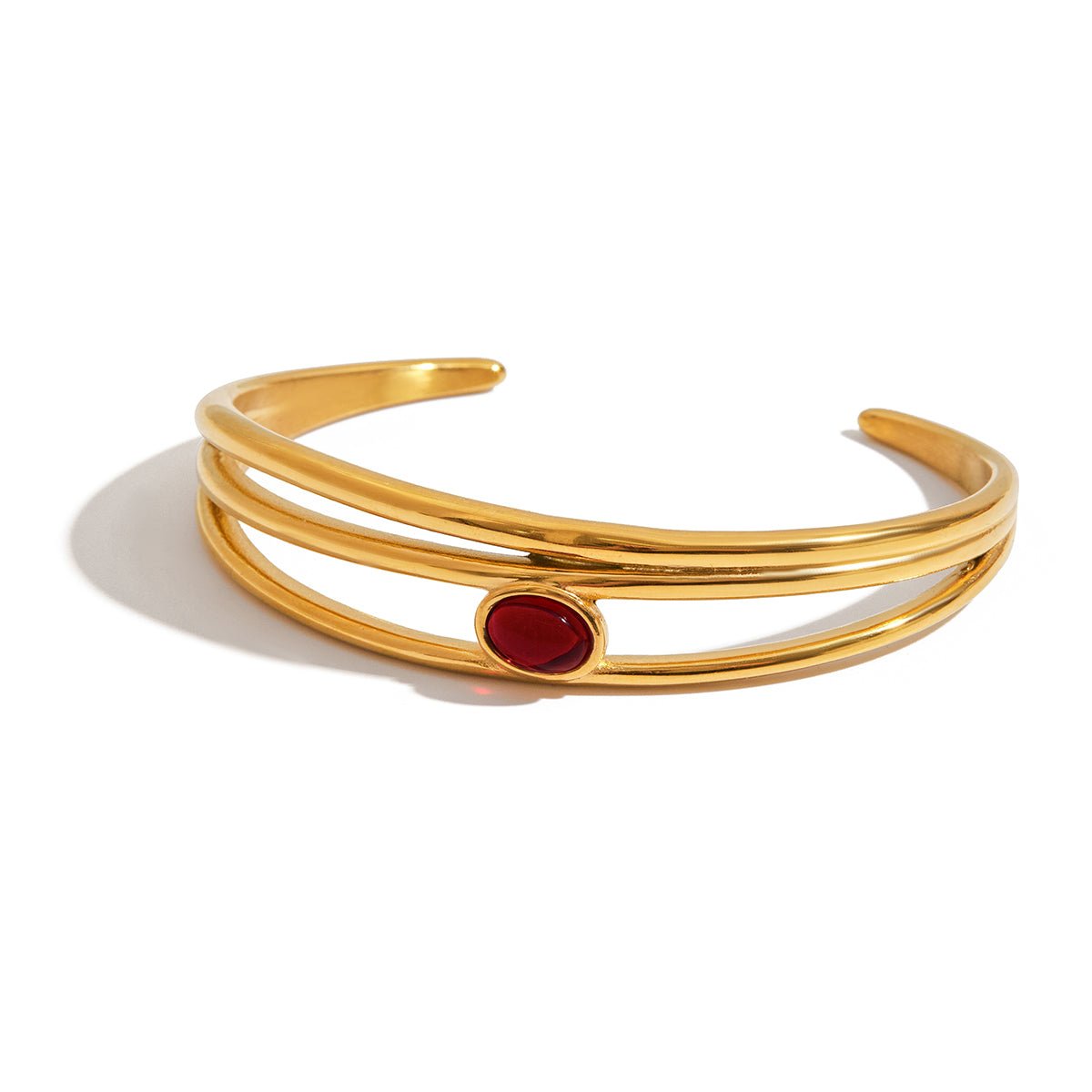 Gold and red gemstone bracelet styled for gifting