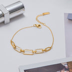 18K gold bracelet flat lay with accessories