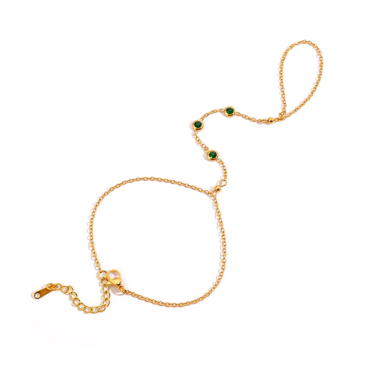 Gold bracelet with green gemstones on a white background