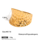 Gold ring with textured design on a white background, showing size, weight, and material information.