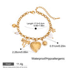 Gold bracelet with charms and measurements on a white background