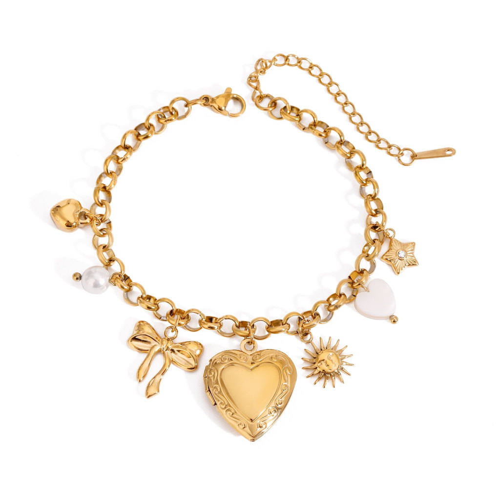 Gold bracelet with various charms on a white background