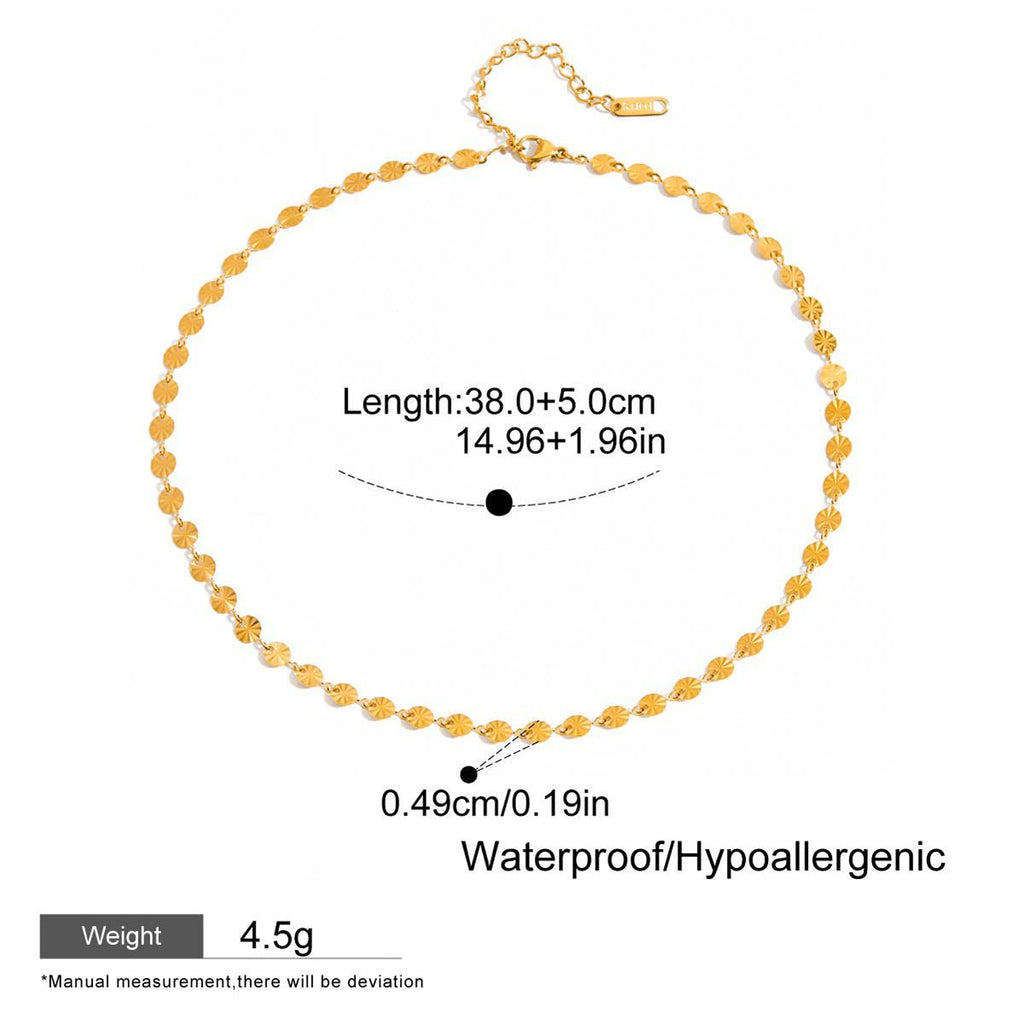 Gold necklace with measurement details on a white background