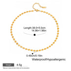 Gold necklace with measurement details on a white background