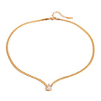 Gold chain necklace with a small pendant on a white background