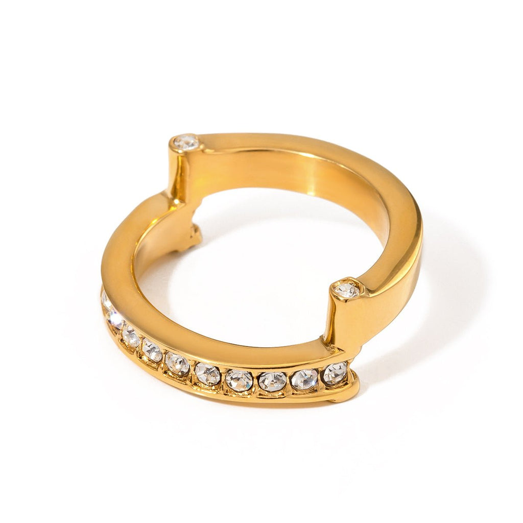 Gold hoop ring with embedded crystals on a white background