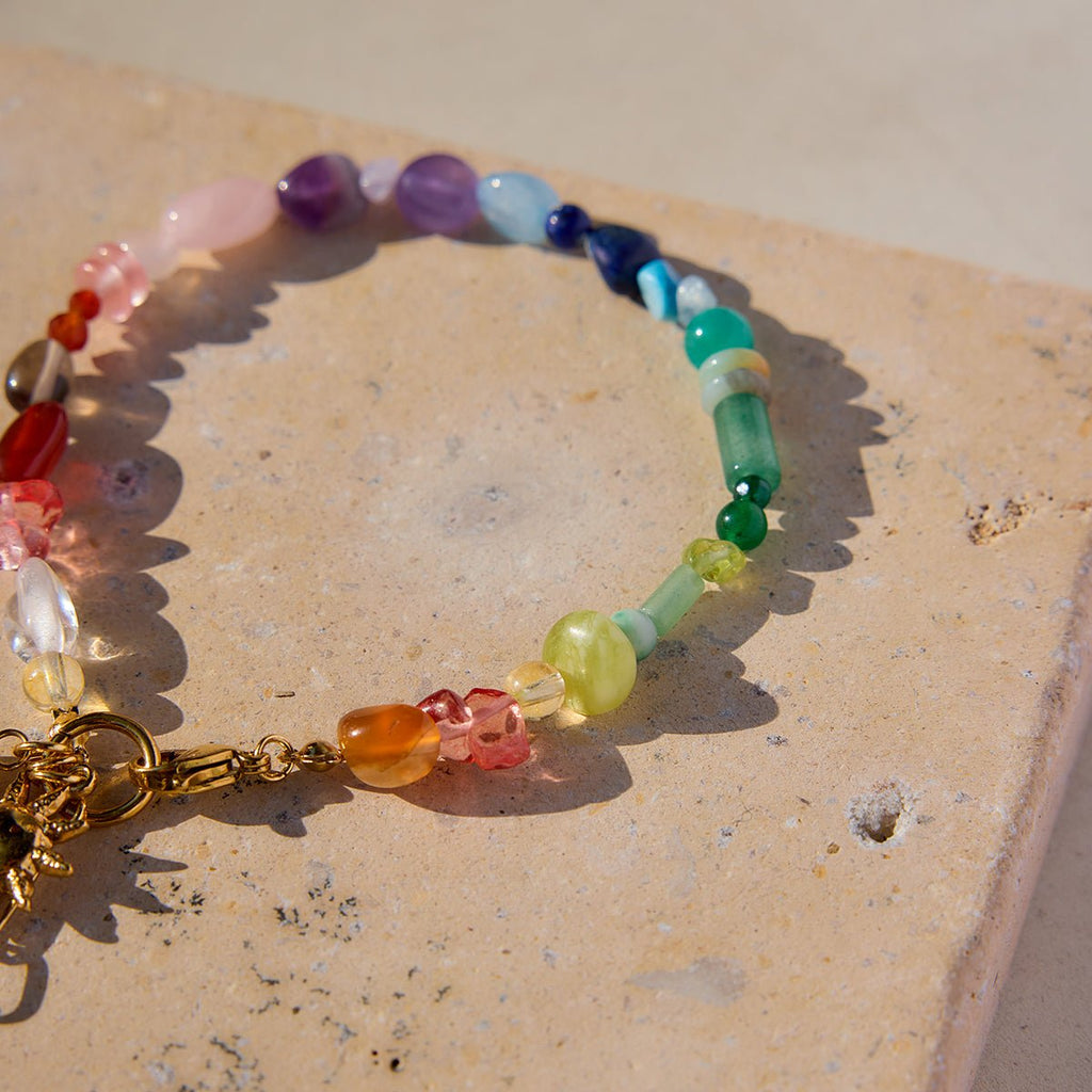 Artistic photo of multicolored gemstone bracelet

