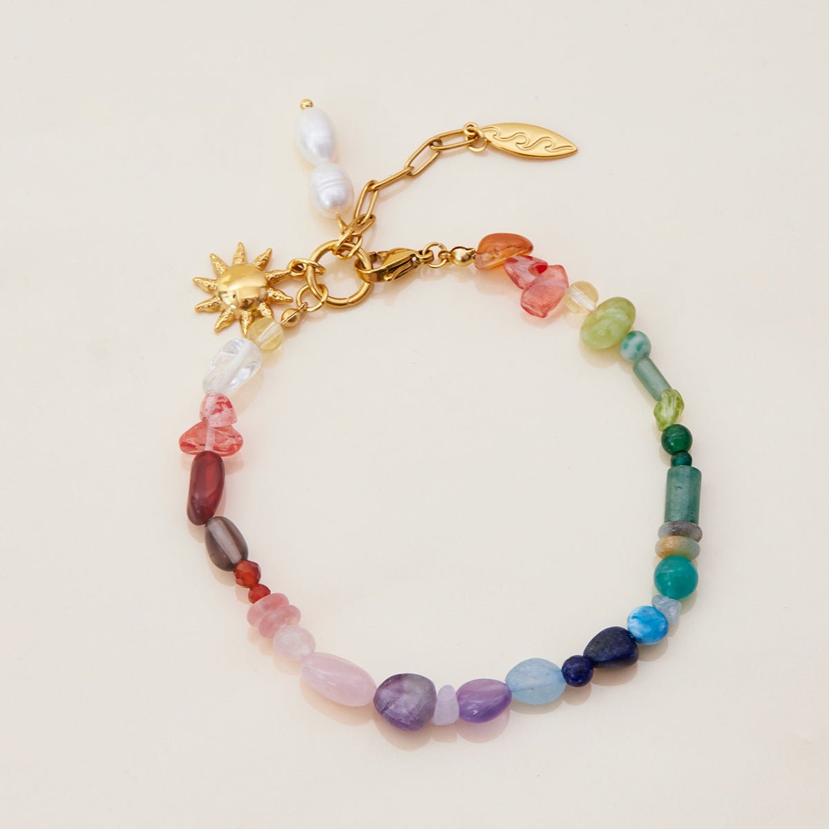 Rainbow gemstone bracelet with pearls and sun charm

