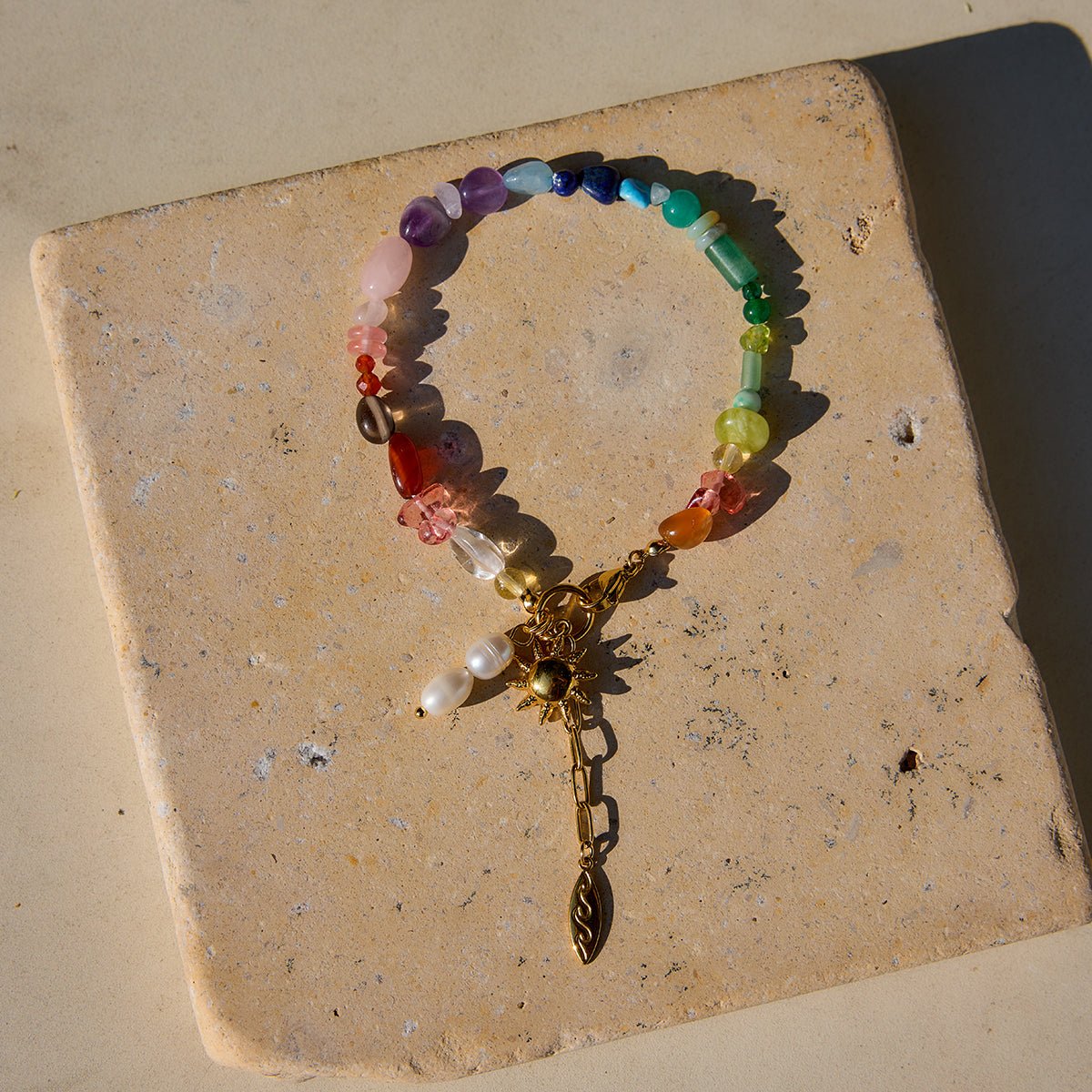 Adjustable charm bracelet with rainbow stones

