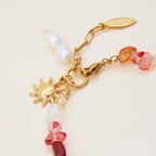 Gold bracelet with multicolored natural stones

