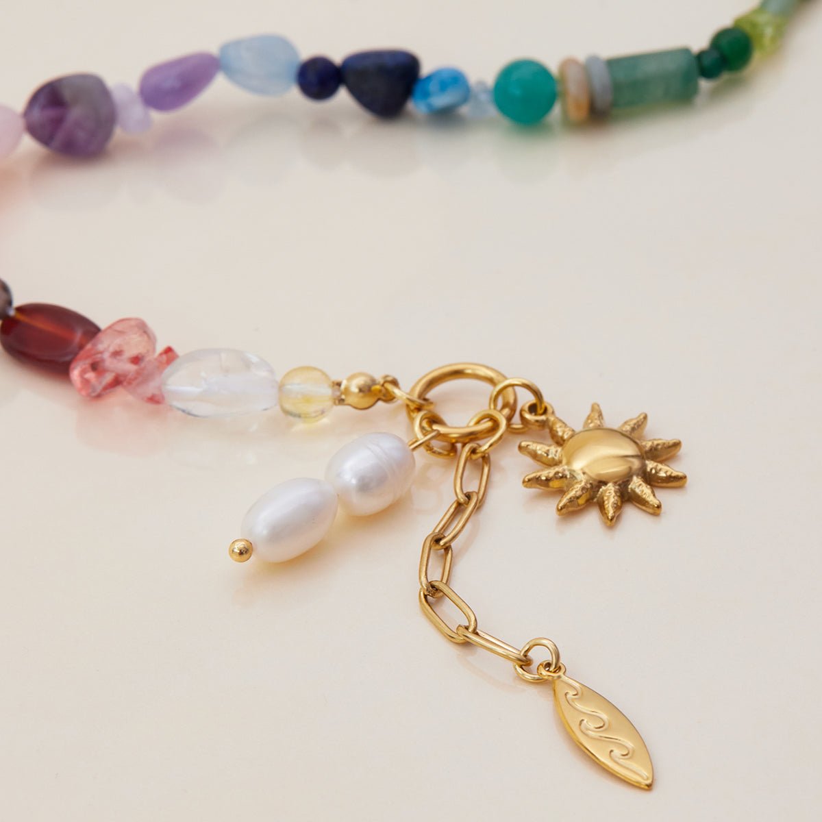 Colorful pearl and gemstone bracelet flat lay

