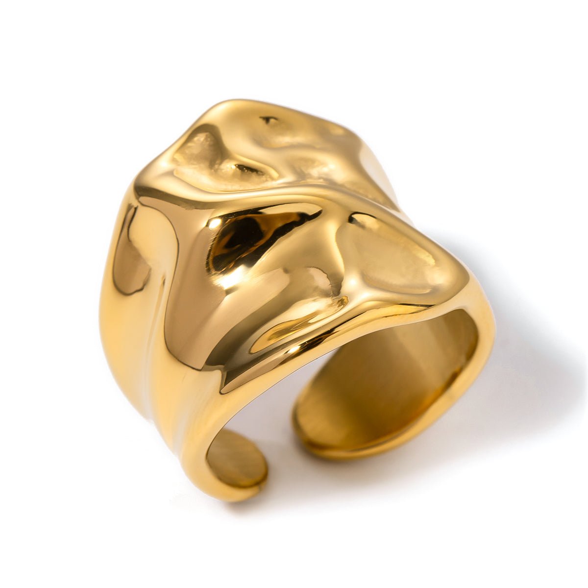 Gold ring with a unique design on a white background