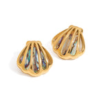 Gold earrings with multicolored gemstones on a white background