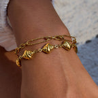 Adjustable gold bracelet with rippled shell links