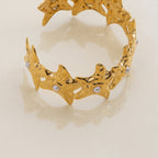 Textured star bracelet with open design in gold
