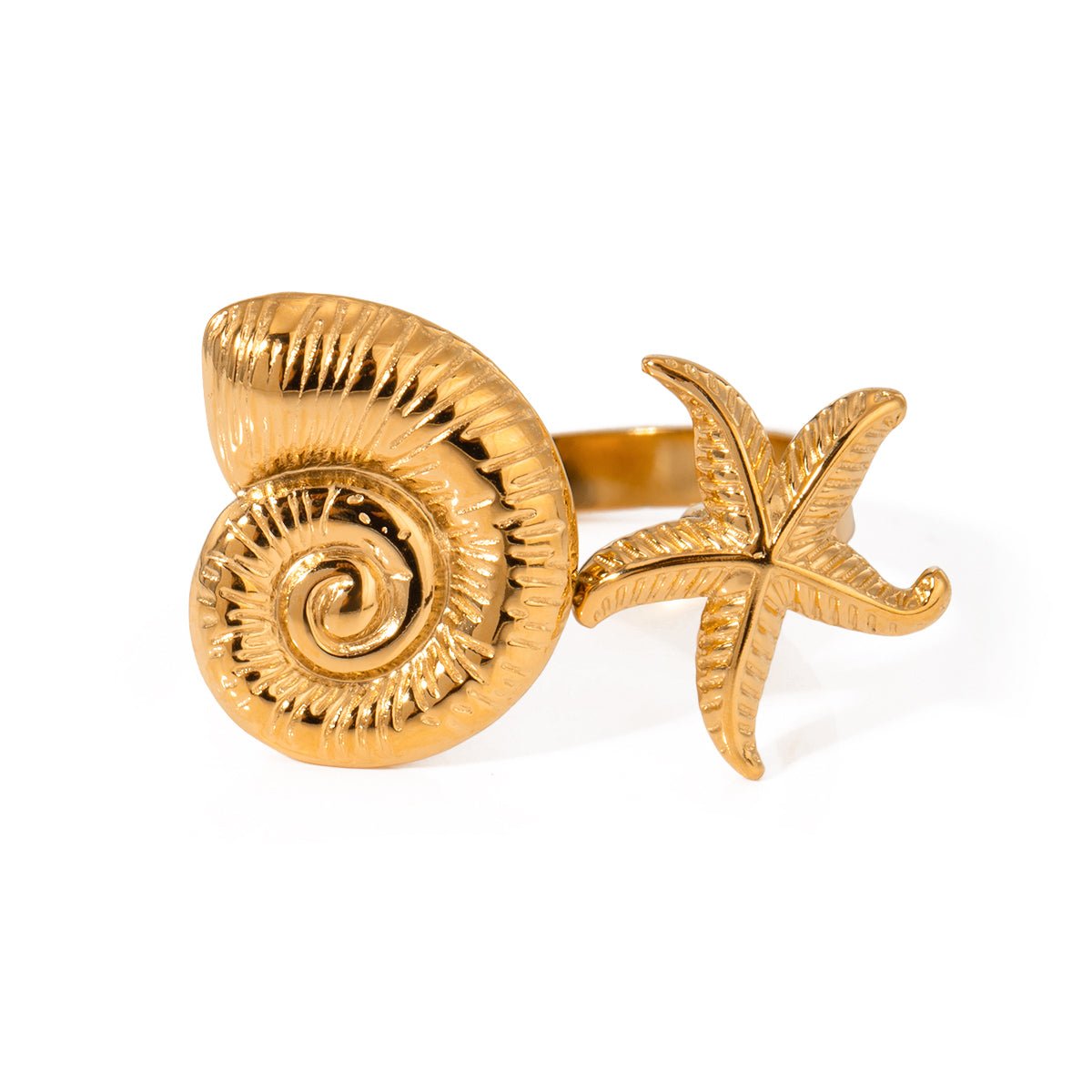 Gold ring with shell and starfish design on a white background