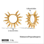 Gold sun-shaped earrings with measurements and product details on a white background