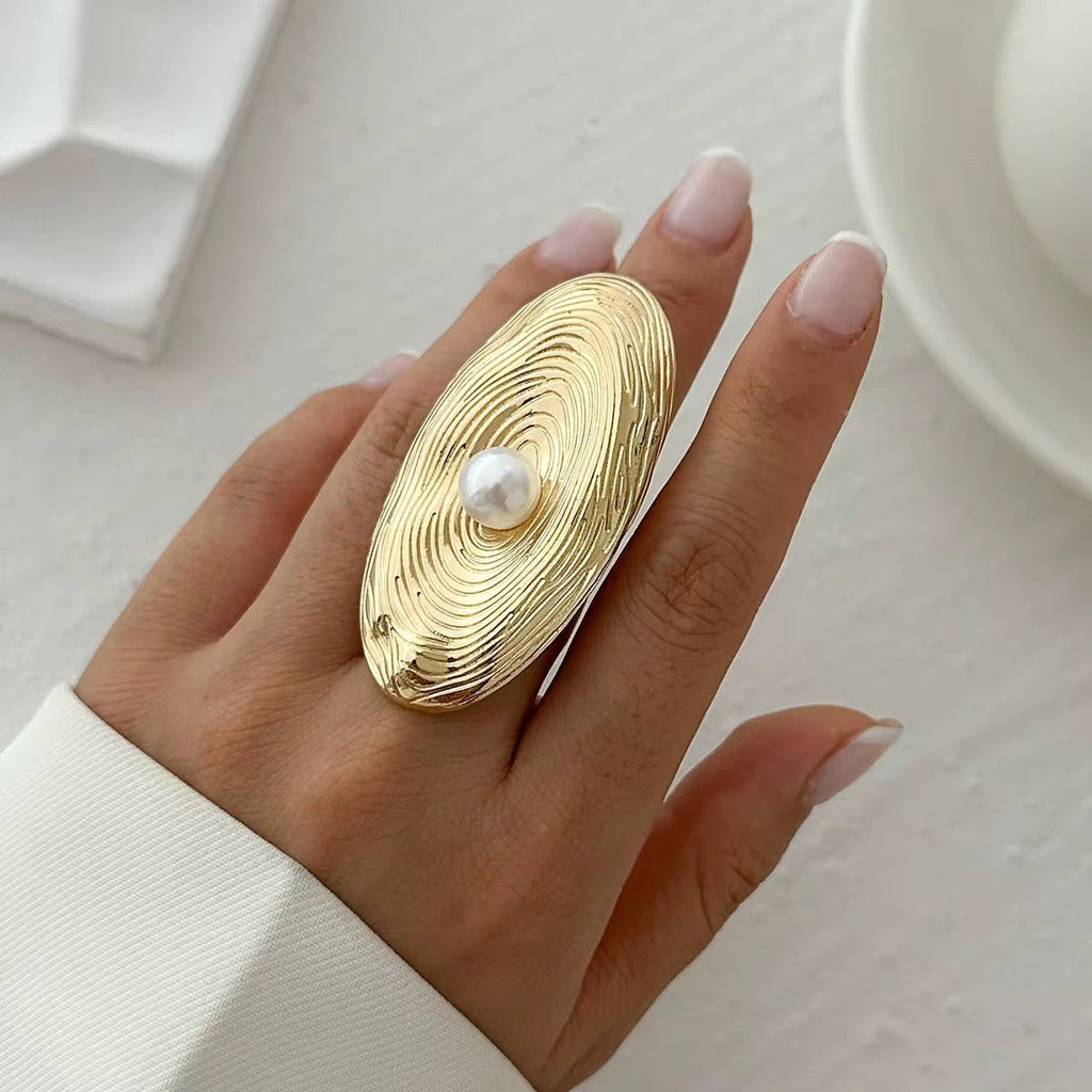 Unique designer ring featuring pearl and texture

