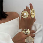 Gold rings with pearls on a white background