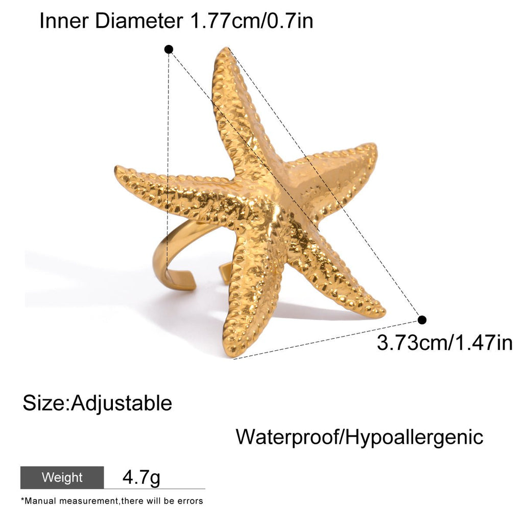 Gold starfish-shaped ring with measurements and product details on a white background
