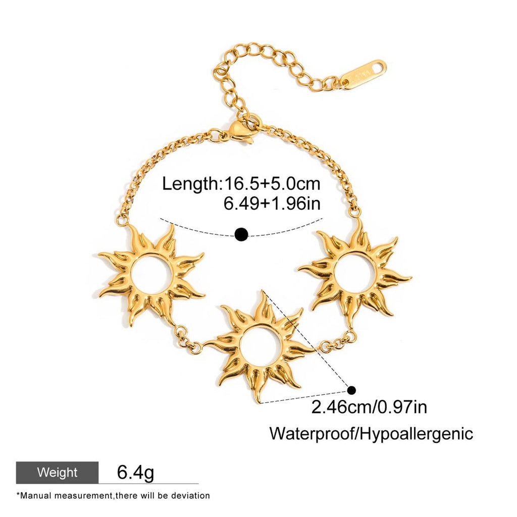 Adjustable gold bracelet with three sun designs

