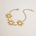 Celestial gold bracelet with radiant sun charms

