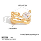 Gold ring with a clear gemstone, showing measurements and material details on a white background.