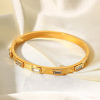 Sleek hinged bangle bracelet with clear stones

