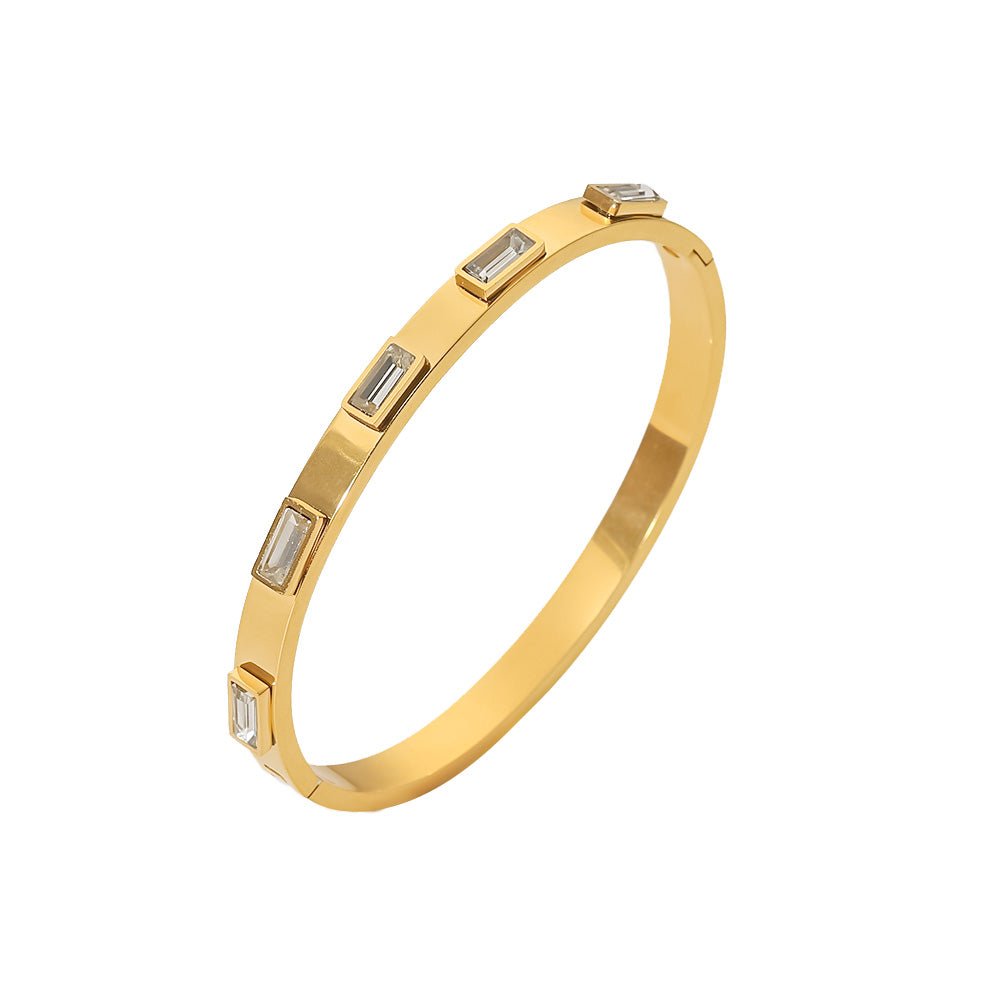 Stackable gold bracelet with baguette-cut crystals

