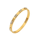 Stackable gold bracelet with baguette-cut crystals

