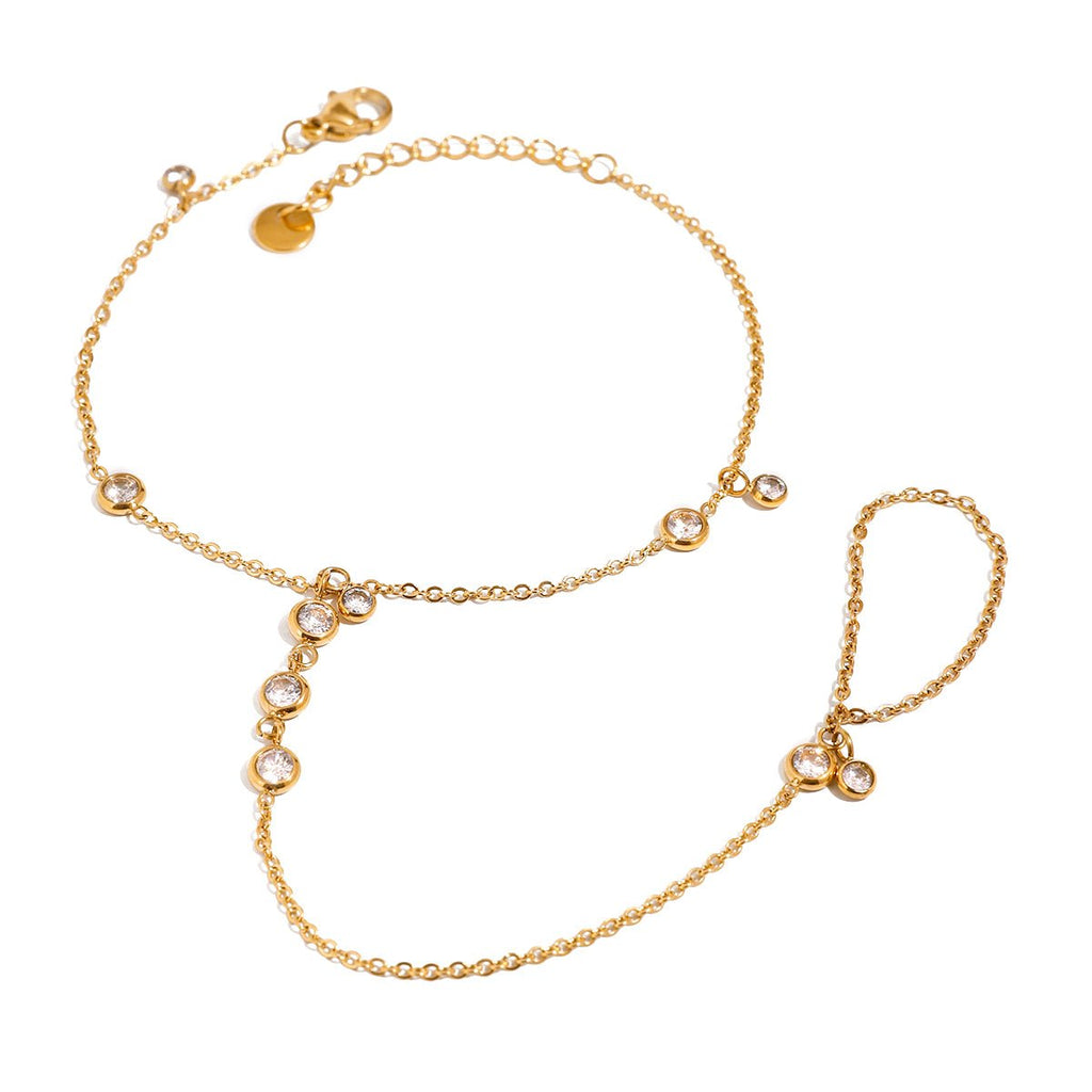 Gold bracelet with small crystals on a white background
