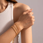 Tarnish-free gold chain bracelet set on white background
