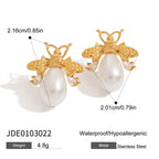 Gold and pearl earrings with measurements and product details on a white background