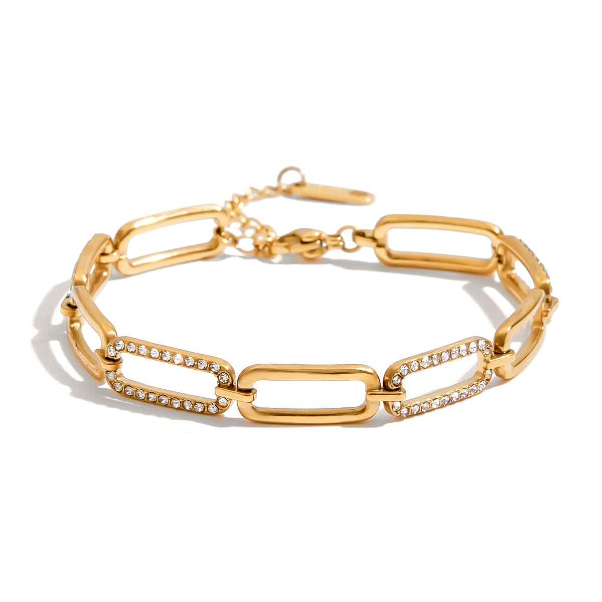 Gold chain bracelet with diamond accents on a white background