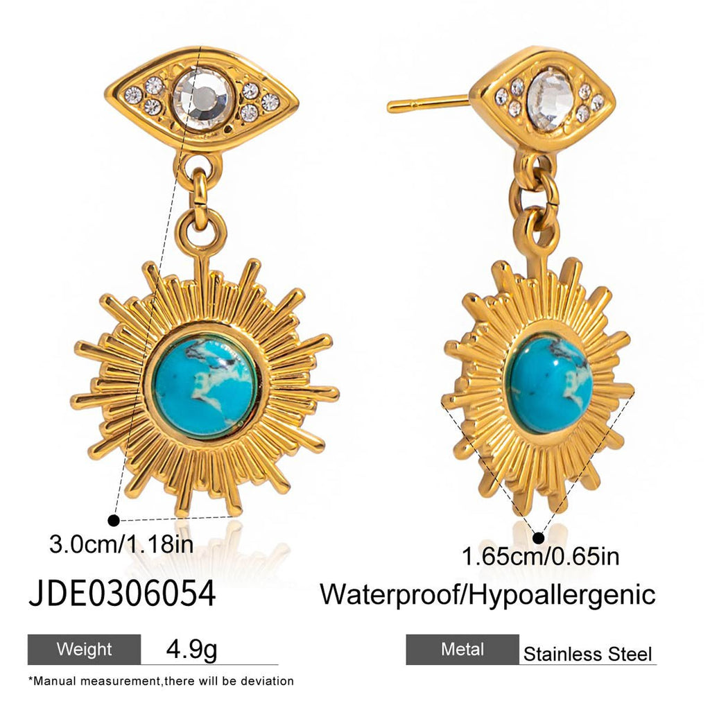Gold earrings with sun design and turquoise center, labeled JDE0306054.