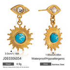 Gold earrings with sun design and turquoise center, labeled JDE0306054.