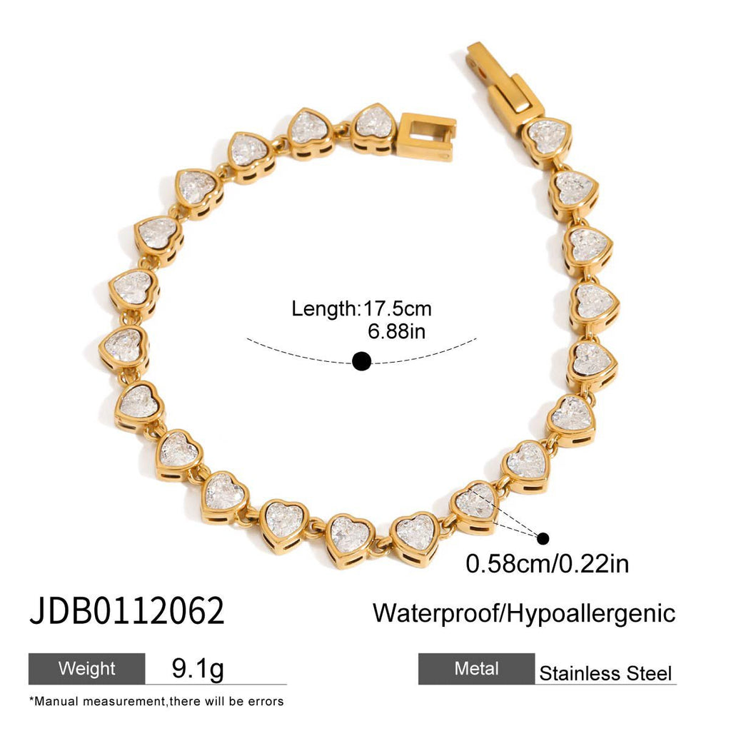 Gold bracelet with heart-shaped links on a white background