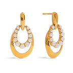 Gold hoop earrings with pearl accents on a white background