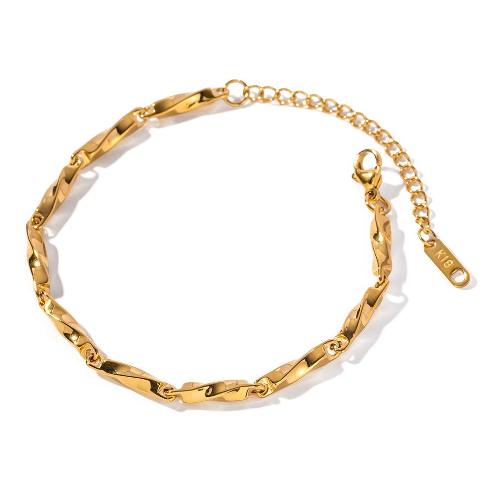 Gold chain bracelet on a white background