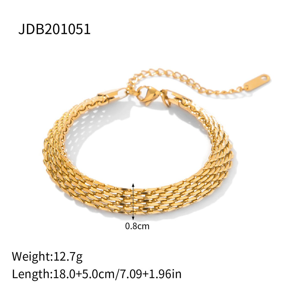 Gold bracelet with measurement details on a white background